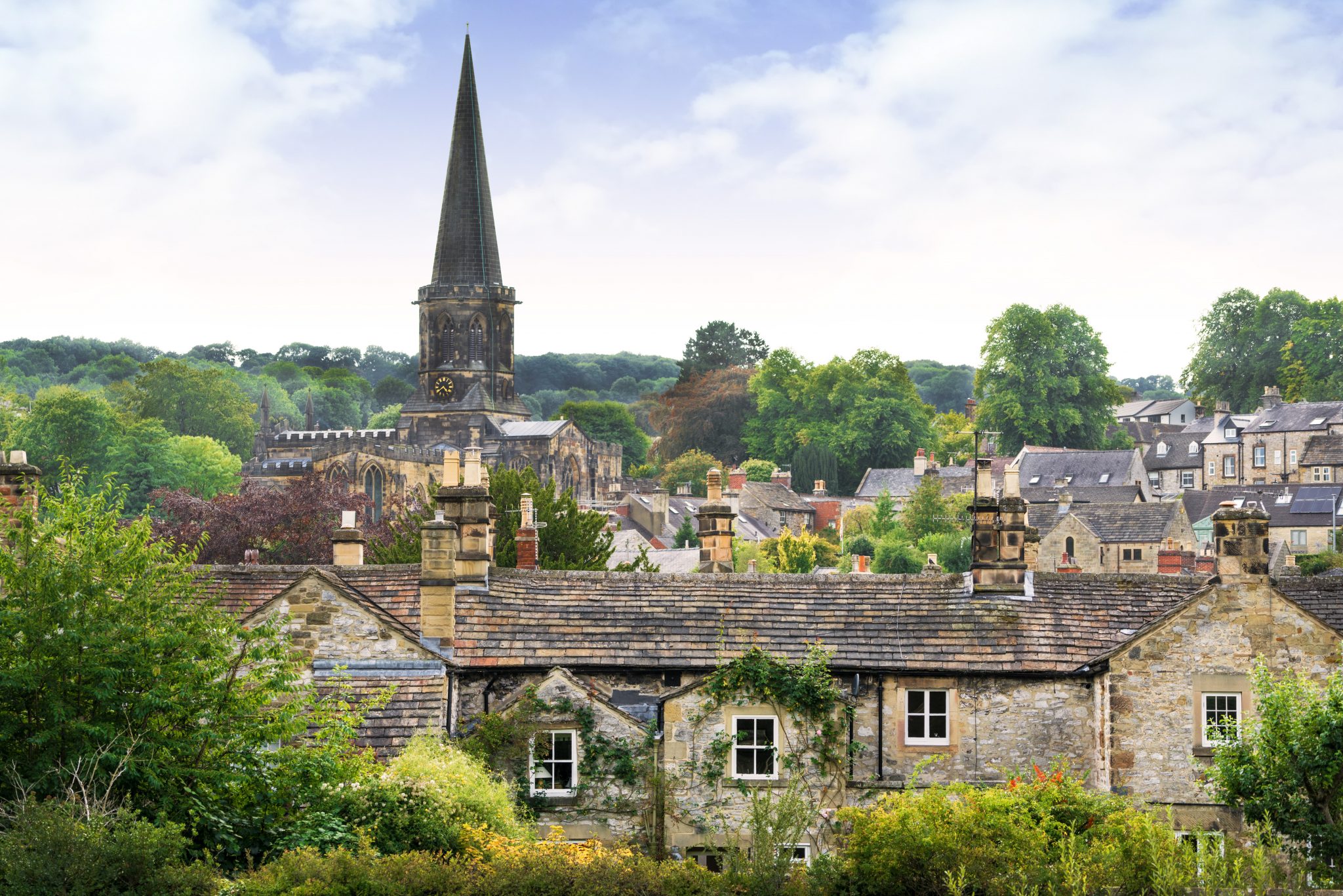 Village with a church spire in the background